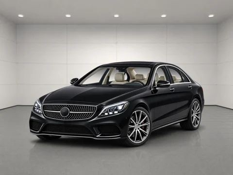 Black sedan in softbox studio setting