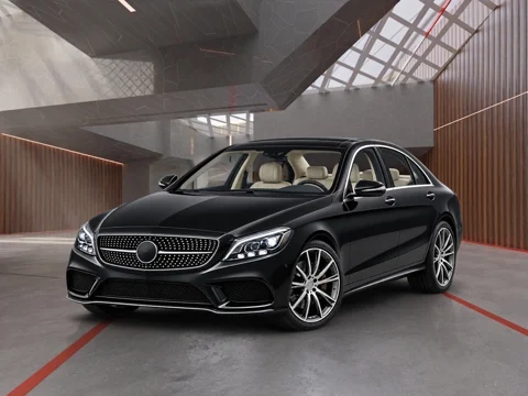 Black sedan in factory skylight setting