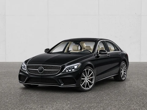 Black sedan in panelled white setting