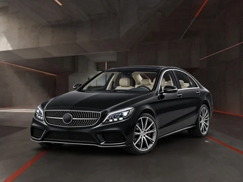 Black sedan in workshop after hours setting