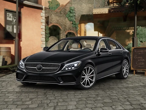 Black sedan in city courtyard setting