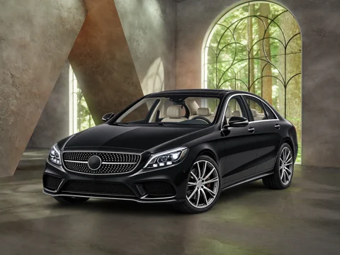 Black sedan in garden arch setting