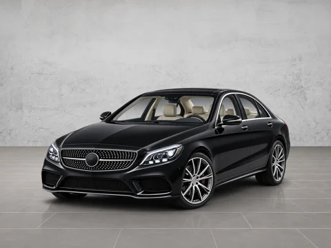 Black sedan in concrete sweep setting