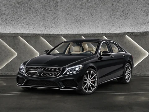 Black sedan in sculpted concrete setting