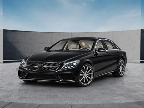 Black sedan in open-air concrete setting