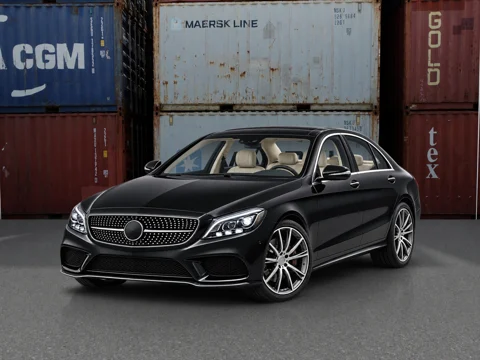 Black sedan in container yard setting