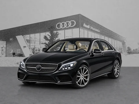Black sedan in showroom entrance setting