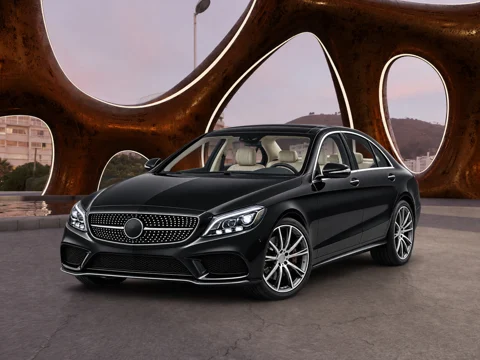 Black sedan in sculptural canopy setting