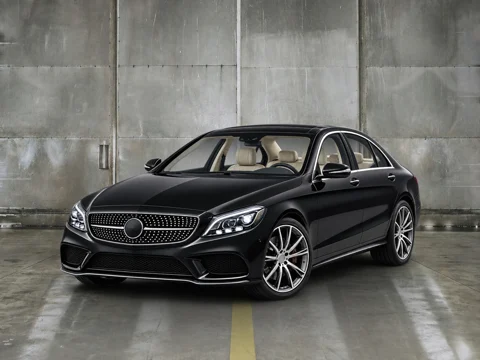Black sedan in raw concrete setting