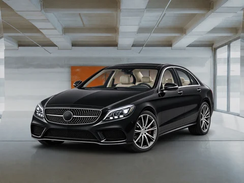 Black sedan in open-plan workshop setting
