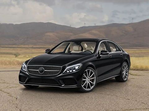 Black sedan in desert overlook setting